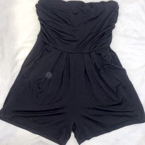 Black form fitting romper.